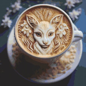 May include: A close-up of a cup of coffee with a latte art design of a fox's face. The fox is surrounded by floral designs and has a light brown and white fur pattern.