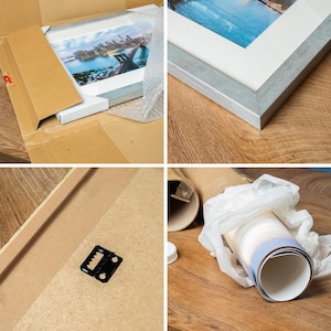 The image is a collage of four photos showing different stages of framing a picture. The first photo shows a framed picture in a box, the second photo shows the framed picture on a wooden surface, the third photo shows the framed picture on a wooden surface with a bubble wrap, and the fourth photo shows the framed picture on a wooden surface with a bubble wrap.