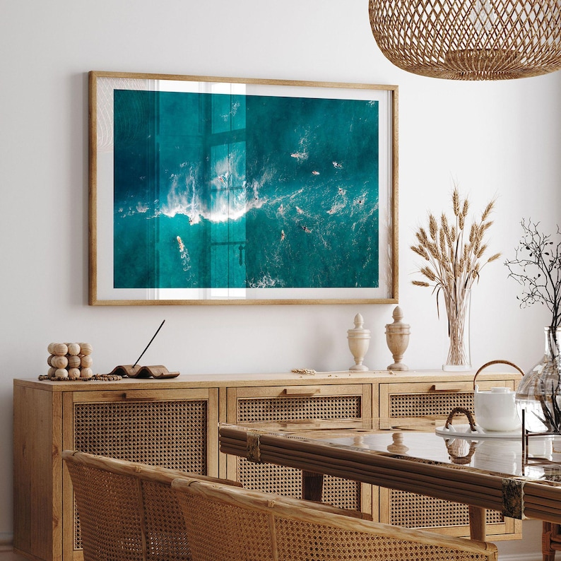 a picture hanging on the wall of a dining room