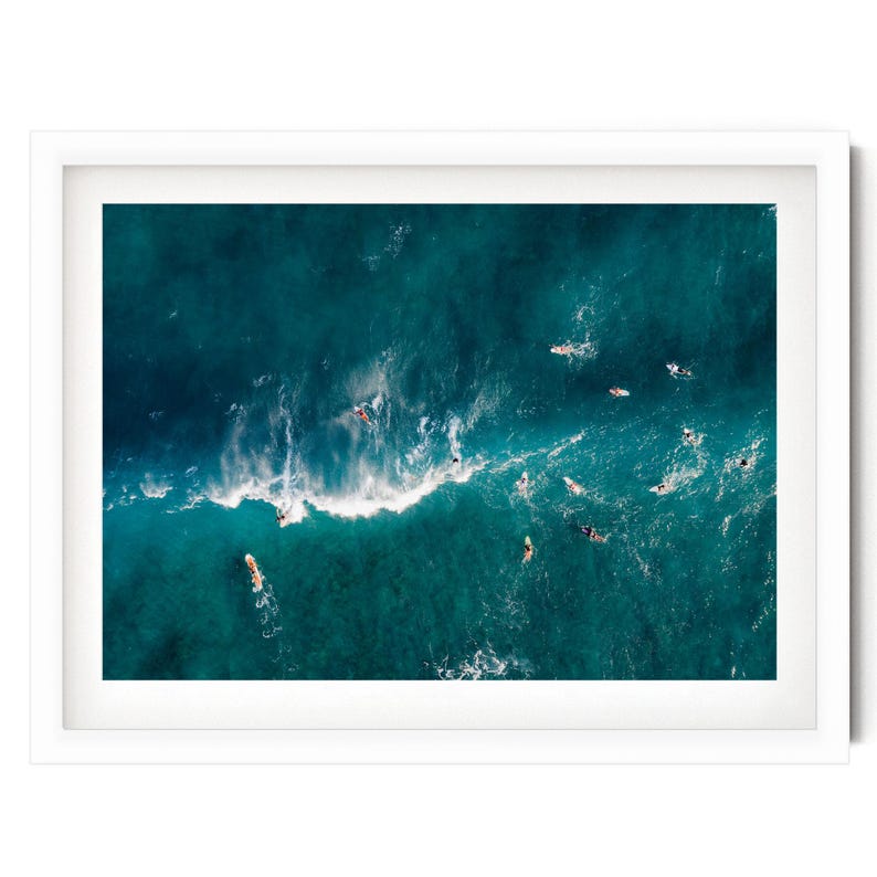 a picture of a group of surfers in the ocean