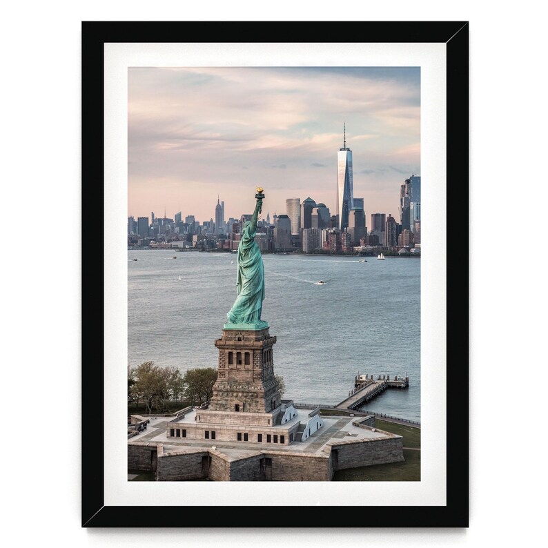 the Statue of Liberty, a famous landmark in New York City, with the city skyline in the background.
