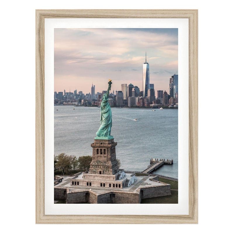 the Statue of Liberty, a famous landmark in New York City, with the city skyline in the background.
