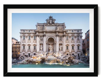 May include: A framed photographic print of the Trevi Fountain in Rome, featuring the central statue of Oceanus, surrounding classical sculptures, ornate architectural details, and a turquoise pool of water set within a black rectangular frame.
