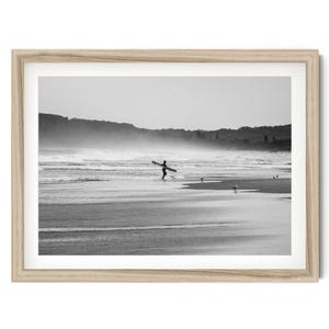 Lone Surfer Print, Minimalist Black and White Beach Wall Art, Framed or Unframed Surf Wall Art for Home Decor, Vintage Coastal Wall Decor