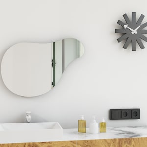 Asymmetrical Wavy Pond Mirror: A Funky Irregular Mirror Addition to Your Space.