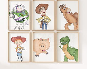 May include: Six framed prints featuring characters from the animated film Toy Story. The prints include Buzz Lightyear, Woody, a horse, Jessie, Hamm the piggy bank, and Rex the dinosaur. The illustrations are in a watercolor style with a white background.