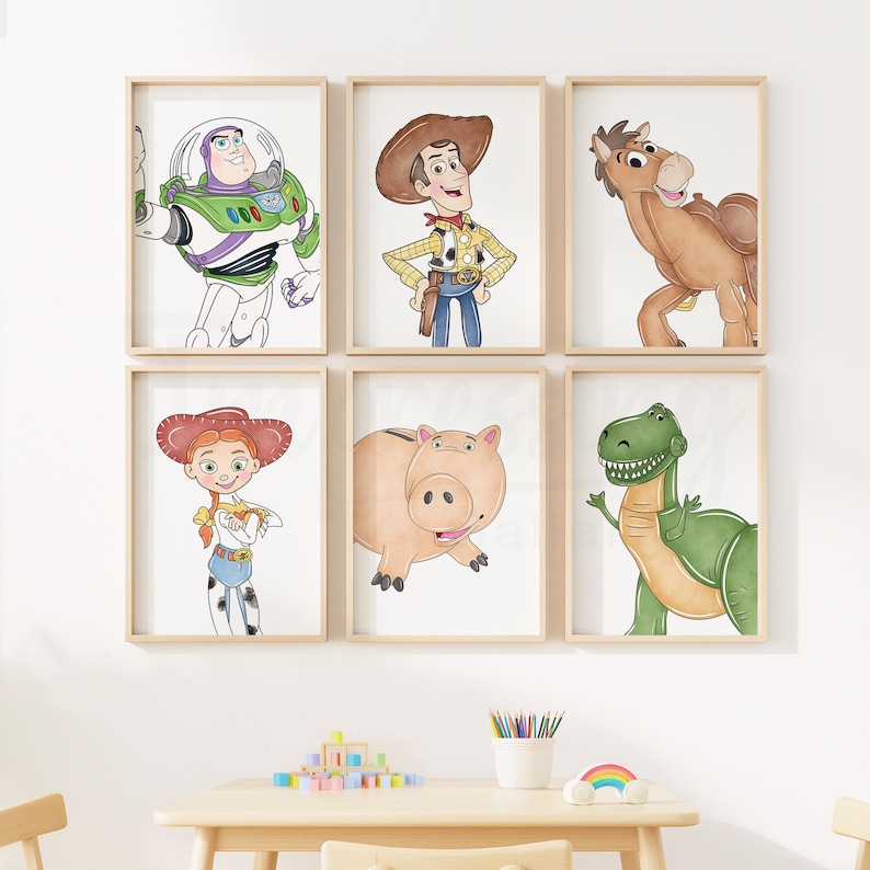 May include: Six framed prints featuring characters from the animated film Toy Story. The prints include Buzz Lightyear, Woody, a horse, Jessie, Hamm the piggy bank, and Rex the dinosaur. The illustrations are in a watercolor style with a white background.