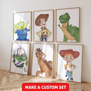 May include: Six framed art prints showcasing characters from the Toy Story film series. The prints depict Woody, Buzz Lightyear, Rex, Jessie, an alien, and Bullseye. The text "MAKE A CUSTOM SET" is printed in red on a white background at the bottom.