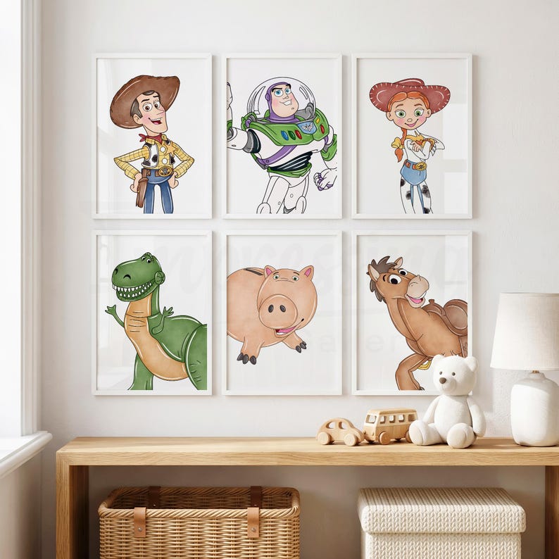 May include: Six framed art prints featuring characters from a popular animated film. The prints include a cowboy, a space ranger, a cowgirl, a green dinosaur, a pink pig, and a brown horse. The artwork is in a watercolor style.
