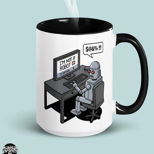 May include: A white ceramic mug with a black handle and the text "But First, Coffee" in a bold, black font. The mug is set against a blurred background, suggesting a cosy setting.