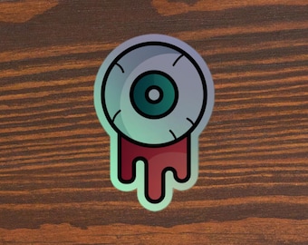 Sticker holographique trippy globe oculaire : cadeau pixel art pour gamer
