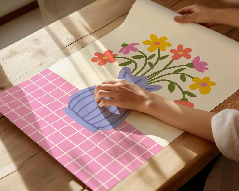 May include: A colorful floral print with a bouquet of flowers in a blue vase on a pink and white checkered background.