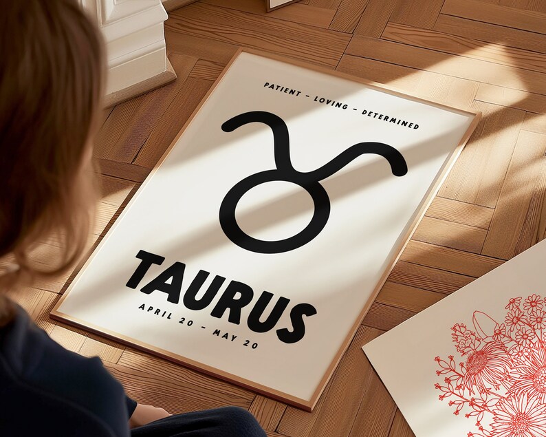 May include: A white poster with black text and a black Taurus zodiac symbol. The text reads "Patient - Loving - Determined" and "Taurus April 20 - May 20".