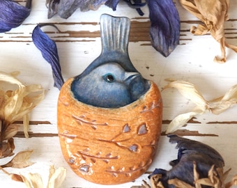Blue bird in the nest brooch pin. Ceramic bird with blue flowers. Easter gift bird in the nest. Pottery brooch bird