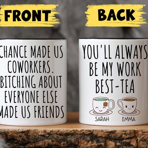 May include: Two white coffee mugs with black handles. The front mug has the text "Chance made us coworkers. Bitching about everyone else made us friends." The back mug has the text "You'll always be my work best-tea" with two cartoon teacups with the names "Sarah" and "Emma" underneath.