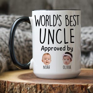 May include: White ceramic mug with a black handle and rim. The mug features the text "WORLD'S BEST UNCLE Approved by" above two baby faces, with the names "NOAH" and "OLIVIA" below them. A gift for an uncle.
