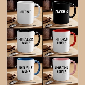 May include: A collection of ceramic mugs in various colors, including white, black, and white with colored handles. Each mug has text that reads "WHITE MUG", "BLACK MUG", or "WHITE/COLOR HANDLE". The mugs are displayed with spoons and pastries.