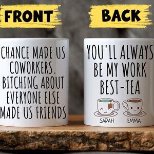 May include: Two white coffee mugs with black text. The front mug reads "Chance made us coworkers. Bitching about everyone else made us friends." The back mug reads "You'll always be my work best-tea" with two cartoon teacups with the names "Sarah" and "Emma" underneath.