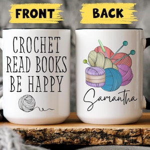 May include: White ceramic mug with black handle and rim. The front of the mug reads "CROCHET READ BOOKS BE HAPPY" with a yarn ball graphic. The back features yarn balls, needles, and the name "Samantha".
