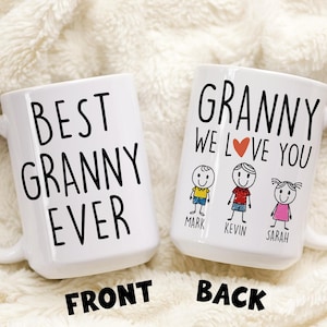 May include: White ceramic mug with black text that reads "Best Granny Ever" on the front and "Granny We Love You" with a red heart and three stick figures on the back.
