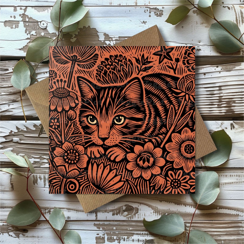 May include: A black and orange linocut print of a cat with a floral background. The cat is looking at the viewer with its head tilted slightly to the side. The flowers are in bloom and have intricate details.