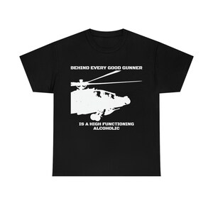 May include: Black t-shirt with a white silhouette of a helicopter and the text "Behind every good gunner is a high functioning alcoholic."