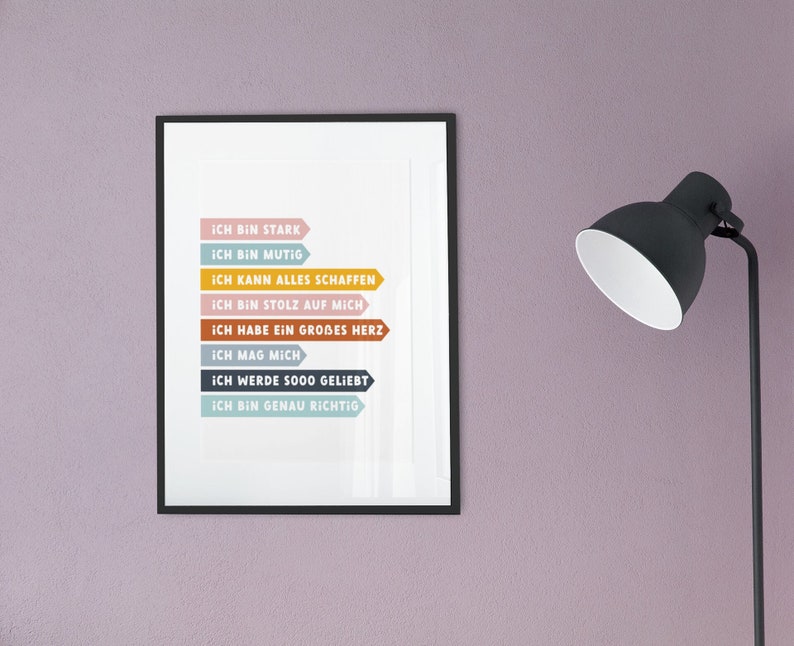 May include: A framed print with a white background and colorful text in German. The text reads "Ich bin stark", "Ich bin mutig", "Ich kann alles schaffen", "Ich bin stolz auf mich", "Ich habe ein gro&szlig;es Herz", "Ich mag mich", "Ich werde sooo geliebt", "Ich bin genau richtig".