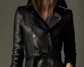 May include: A black leather trench coat with a double-breasted closure, a belt, and a classic collar.