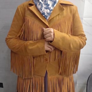 Boho vintage suede fringe cowgirl camel jacket. Women's western golden tassel outerwear design.