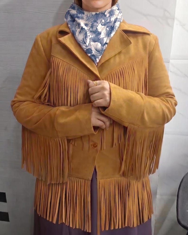 Boho vintage suede fringe cowgirl camel jacket. Women's western golden tassel outerwear design.