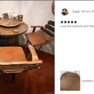 May include: Four brown leather bar stools with wooden frames and a brown wooden barrel table with a round top. The table has a rotating top and a brown leather seat cushion. The stools have a brown leather seat cushion and a wooden back.