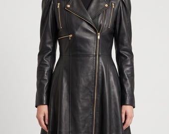 May include: A black leather coat featuring a long, flared silhouette, puff sleeves, and a notched lapel collar. The garment includes a full-length front zipper, two diagonal zippered chest pockets, and gold-toned metal hardware accents throughout.
