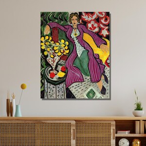 May include: A painting of a woman in a purple robe sitting on a yellow couch. The woman is surrounded by flowers and fruit. The painting is in a cubist style.