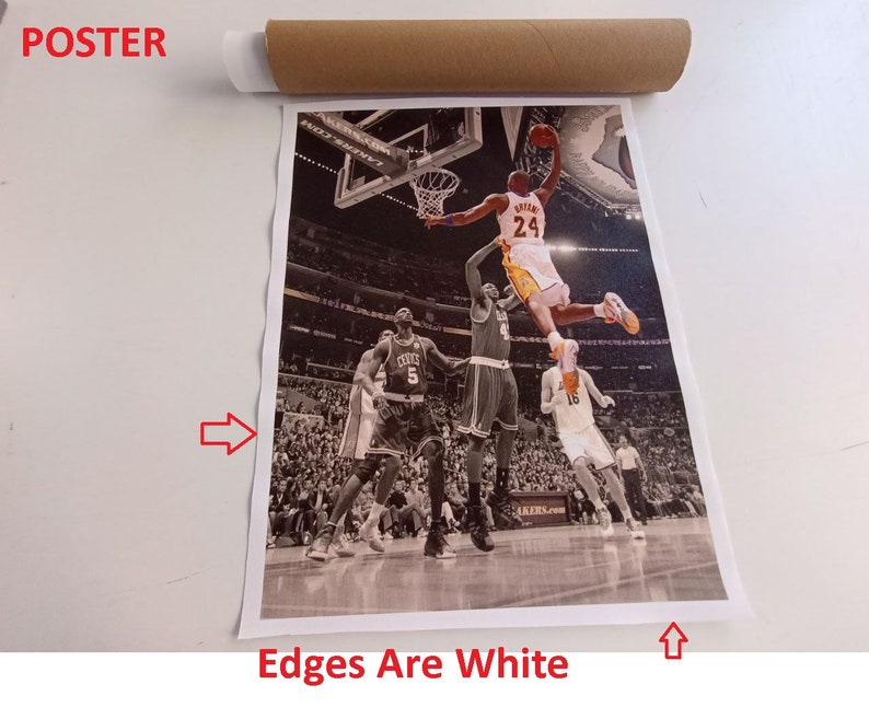 May include: A black and white poster featuring a basketball player in mid-air, dunking the ball. The player is wearing a yellow jersey with the number 24 on it. The poster has white edges.