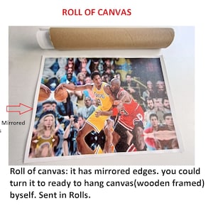 May include: A rolled canvas print of a basketball game featuring two players in action. The canvas has 1-2 inch mirrored edges. The text "ROLL OF CANVAS" is at the top of the image.