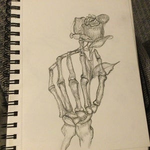 Skelton hand holding rose drawing
