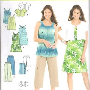 May include: Simplicity sewing pattern 3799 featuring various women's tops, dresses, and pants. The pattern includes a blue and green tie-dye top, khaki capri pants, and a green floral dress. The text "easy-to-sew" is visible.