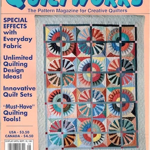 May include: A magazine cover for Traditional Quiltworks, issue number 15, August/September 1991. The cover features a colorful quilt with a 9-patch design. The quilt is made up of circles with radiating spokes in various colors, including red, blue, green, yellow, and black. The magazine title is in large, bold, blue letters. The text "Special Effects with Everyday Fabric" is in black letters on the left side of the cover.