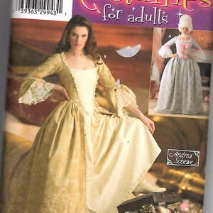 May include: Simplicity pattern 4092 for adult costumes. The pattern includes instructions for making a white and gold gown with a lace trim and a white and gray gown with a lace trim. The pattern is for sizes 6, 8, 10, and 12.
