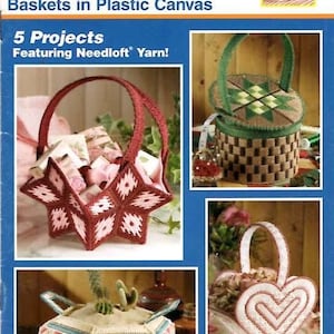 May include: A craft instruction booklet titled Quick Count Plastic Canvas Baskets in Plastic Canvas featuring five projects. The cover displays photographs of various handmade baskets crafted from plastic canvas and yarn in star, heart, and round shapes.