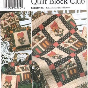 May include: Simplicity Quilt Block Club pattern 9371, Lesson #5 Schoolhouse & Sunbonnet. The sewing pattern envelope features illustrations of a quilt, a ruffled pillow, and a tote bag, all decorated with schoolhouse and sunbonnet motifs.