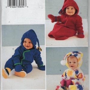 May include: Butterick sewing pattern P286 featuring three variations of a hooded infant bunting or jumpsuit. One version is solid blue with green trim, one is solid red with blue trim, and one is white with a colorful floral print pattern.