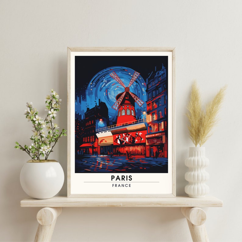 May include: A colorful illustration of the Moulin Rouge in Paris, France. The windmill is red and white, with a blue sky and stars in the background. The text "PARIS" and "FRANCE" is at the bottom of the image.