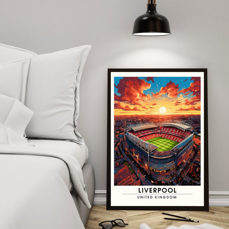 May include: A digital illustration of Anfield Stadium in Liverpool, England, at sunset. The stadium is surrounded by a cityscape and the sky is a vibrant orange and red. The text "Liverpool, United Kingdom" is at the bottom of the image.