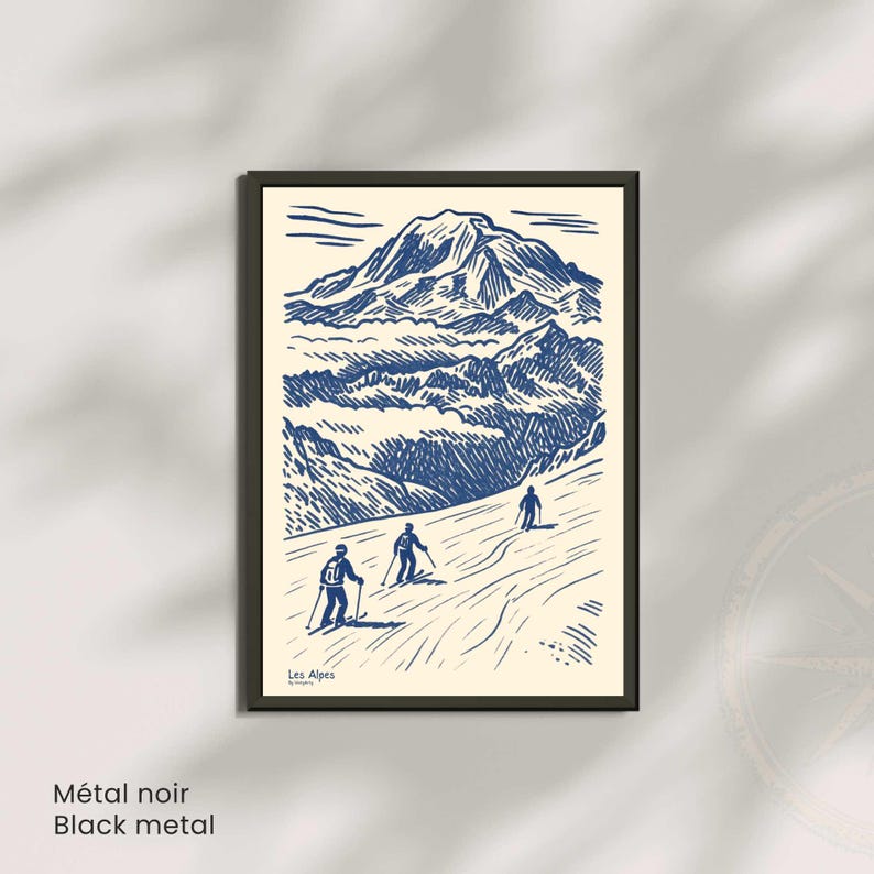 May include: A framed print with a blue and white illustration of a mountain range and three skiers. The words "Les Alpes" are in the lower left corner. The frame is black, and the text "M&eacute;tal noir Black metal" is at the bottom.