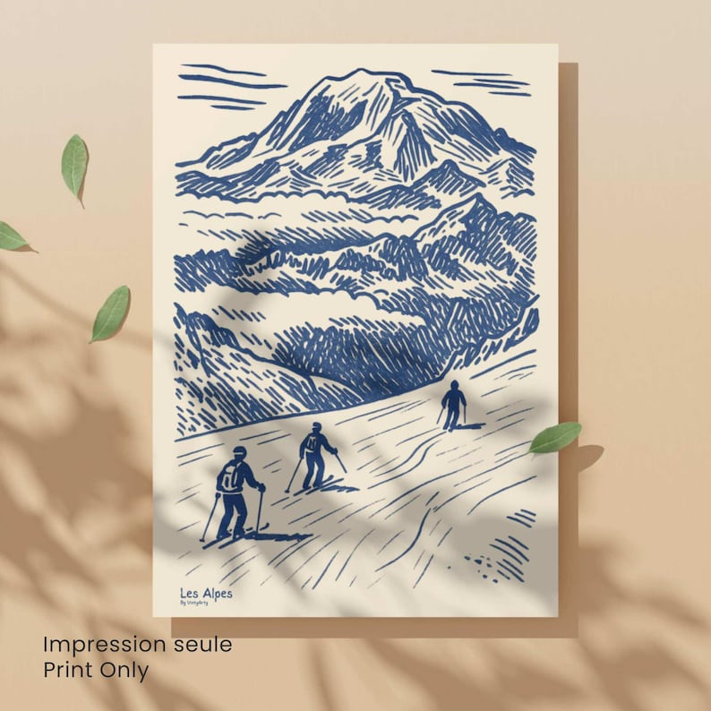 May include: A print depicting a blue and white illustration of a mountain range with skiers on a slope. The print includes the text "Les Alpes" and "Print Only". The artwork has a vintage aesthetic.