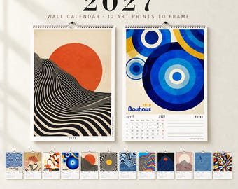 May include: A 2027 wall calendar featuring 12 art prints to frame. The top display shows two pages: one with a large orange circle over black and white wavy lines, and another with blue and yellow concentric circles and the text Bauhaus 1919.