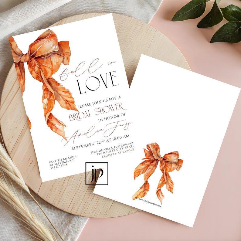 May include: A white bridal shower invitation card featuring a watercolor illustration of an orange ribbon bow. The text reads: fall in LOVE, PLEASE JOIN US FOR A BRIDAL SHOWER IN HONOR OF Amelia Jones, SEPTEMBER 22ND AT 10:00 AM, SEASIDE VILLA RESTAURANT.