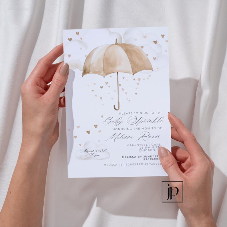 May include: A white baby shower invitation with a watercolor illustration of a brown umbrella with gold hearts falling from it. The text reads "Please join us for a Baby Sprinkle honoring the mom to be Melissa Russe, August 23rd, 1:00 pm, Main Street Cafe, 123 Main St, Chicago, Melissa by June 12th, 123.123.123, Melissa is registered at Target."