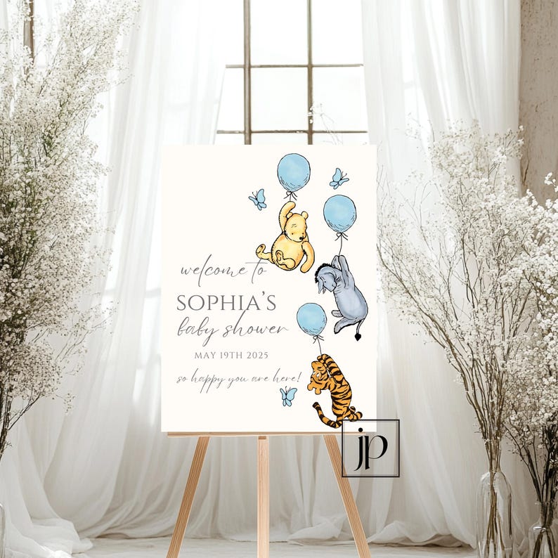 May include: A Winnie the Pooh themed baby shower welcome sign with blue and yellow balloons, a Winnie the Pooh character, a Tigger character, and a donkey character. The sign says "Welcome to Sophia's Baby Shower May 19th 2025 So happy you are here!"